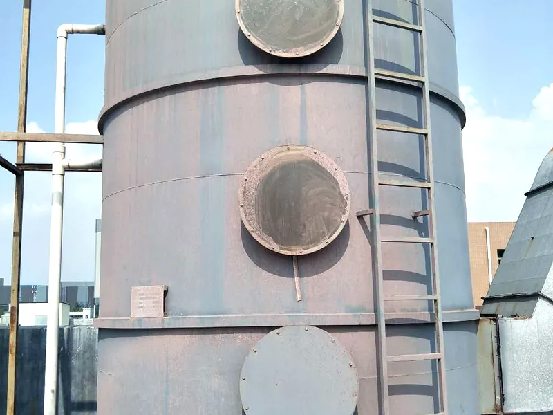Wet scrubber tower internal packing and spray system